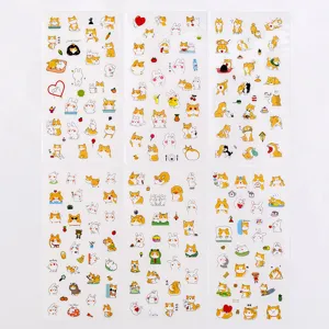 Detailed view of six sheets of cute cartoon Shiba Inu dog and rabbit sticker sets for journaling.