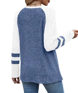 Detailed view of women's long sleeve color block waffle knit top featuring striped sleeves.
