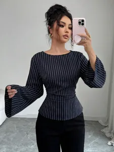 Detail view of the elegant pinstripe peplum blouse with chic flared long sleeves.