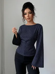 Striped long sleeve blouse with crew neck and tie waist detail, elegant autumn fashion top.