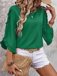 Detailed shot of the elegant green ruffle three-quarter sleeve top in daily lifestyle scene.