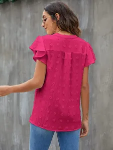 Detailed view of women's short sleeve ruffle V-neck pompom chiffon blouse in pink.