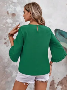 Green ruffle 3/4 sleeve blouse detail, round neck with back button, casual summer top view