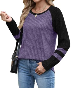 Detail view of the stylish color-block long sleeve sweater, featuring a classic round neck.