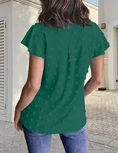 Back view detail of the green swiss dot chiffon blouse featuring short flutter sleeves.