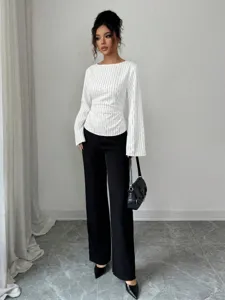 Detailed view showcasing the elegant pinstripe long sleeve blouse with stylish tie waist.