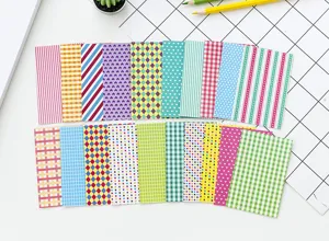 Close-up detail of colorful decorative stickers with geometric patterns for DIY journals.