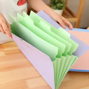 Plastic expanding file folder accordion document organizer with multi-layer green dividers.