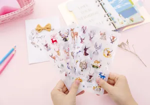 Detailed view of transparent watercolor elk stickers, cute deer journal decorative decals.