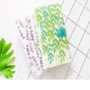 Botanical print card holder photo album with snap closure, ideal for organizing cards and tickets.