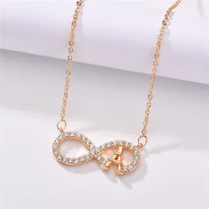 Elegant gold-plated infinity zircon necklace with tower pendant, perfect fashion accessory.