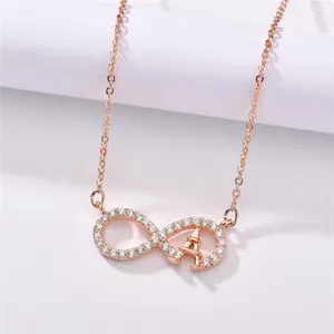 Rose gold-plated infinity pendant necklace featuring a sparkling crystal-set Eiffel tower design.