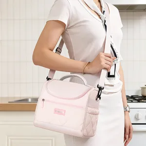 Insulated lunch bag for women, pink quilted crossbody bento bag with handle and strap.
