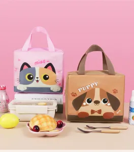 Detailed view of cute cartoon cat and dog insulated lunch bags set with lunch box and food props.