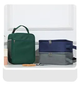 Detailed view of the insulated lunch bag featuring mesh side pockets and smooth dual zippers.