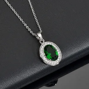 Elegant green oval cubic zirconia halo pendant necklace with sparkly stones and chain.