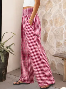 Detail view of red white gingham high waist wide leg pants, elastic waist and side pockets.