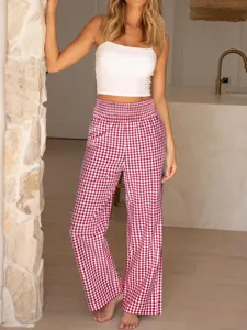 Close-up detail of casual red plaid high-waist wide-leg pants with elastic waist for daily wear.