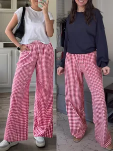 Home try-on detail showing red and white plaid high waist wide leg pants with pockets.