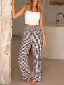 Checkered high waist wide leg pants detail shot, casual daily fashion style in home setting.