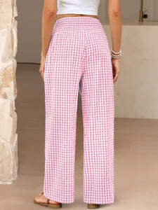 Back view detail of casual pink and white gingham loose pants with smocked waist.