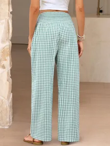 Green plaid wide-leg pants, high elastic waist casual trousers detail view in bright interior.