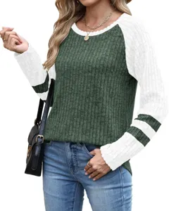 Detailed view of the women's colorblock long sleeve knit sweater with crewneck and striped sleeves.
