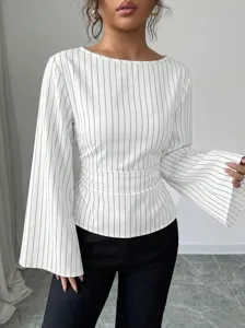 Close-up detail of women's black and white striped long sleeve blouse with flare cuffs.