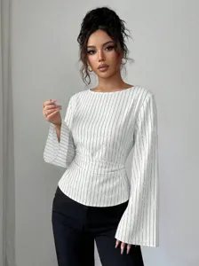 Detail shot of women's striped long sleeve blouse with waist tie and chic round neck design.