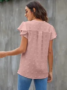 Chic pink V-neck flutter sleeve blouse with charming textured polka dot details for summer style.