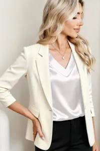 Satin V-neck top detail shot, elegant silver silk fabric, versatile modern women apparel.