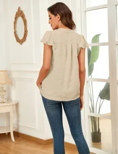 Back view detail of women's beige textured short sleeve blouse with ruffled design.