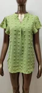 Light green V-neck short sleeve top with ruffle sleeves and cute pompom textured details.