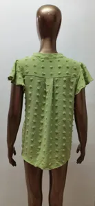Green short sleeve chiffon blouse with pompom details and ruffle sleeves, back view detail.