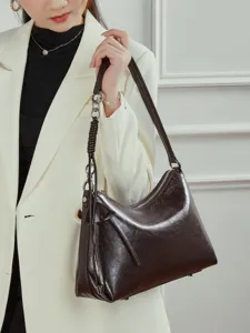 Elegant genuine leather shoulder bag for women, stylish underarm hobo bag for daily commute.