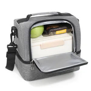 Interior detail of grey insulated lunch bag with foil lining and spacious compartments.