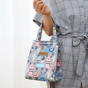 Grey cute alpaca print insulated lunch bag with handle, perfect for office and school.