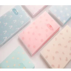 Detailed view of pastel translucent card albums featuring cute frosted texture and design.