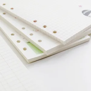 A6 6-hole loose-leaf planner refills with grid and lined paper inner pages for daily planning use.
