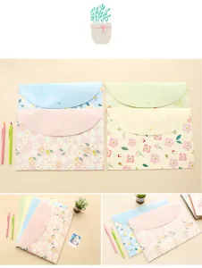 Close-up detail of A4 plastic document folders featuring cute floral patterns and snap button.