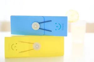 Candy color frosted PP plastic pencil box with elastic band closure and cute smile design.