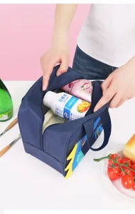 Detail view of a cute cartoon insulated lunch bag, featuring spacious interior for daily meals.