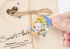Close-up detail shot of cute cartoon cat sticker on craft paper packaging material.