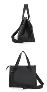Black triangular insulated lunch bag with shoulder strap, durable portable bento tote for daily use.