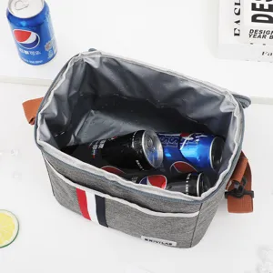 Insulated lunch bag with shoulder strap, waterproof lining, perfect for outdoor picnics and work.