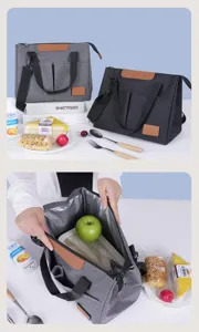 Portable insulated lunch bag with cross-body strap, stylish triangular cooler bag for outdoor use.