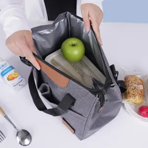 Insulated lunch bag for women and men, grey thermal tote bag with shoulder strap.
