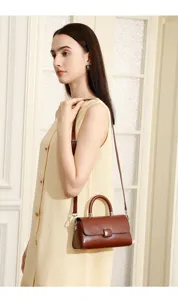 Elegant genuine leather women shoulder handbag detail shot, lightweight and stylish everyday bag.