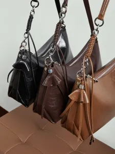 Classic leather underarm shoulder bag for women, stylish hobo crossbody purse with chain.
