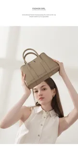 Detail shot of premium leather handbag, elegant top handle design, exquisite craftsmanship.